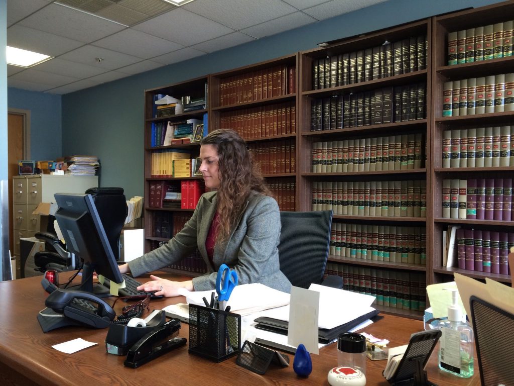 William Booth Legal Aid Clinic Director Amy Roemer works in her office.